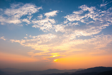 Colorful sunset and sunrise with clouds.Blue and orange color of nature.Many white clouds in the...