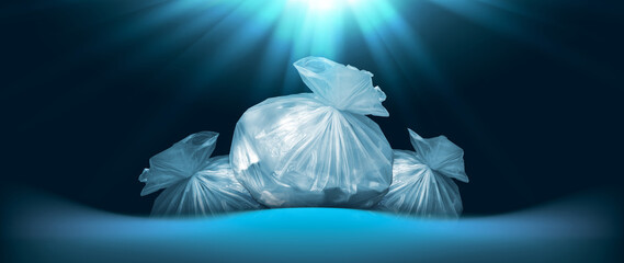creative background of plastic garbage bags found at bottom of sea or ocean with rays of sunlight...