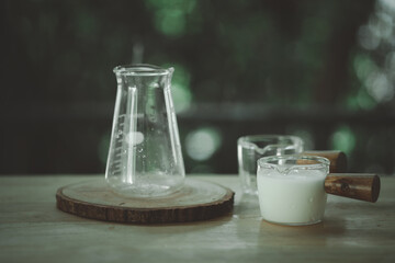 Fresh milk in mini transparent glass cup