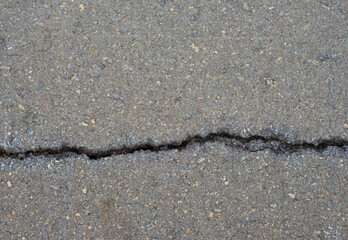 Cracked texture on the concrete pavement.