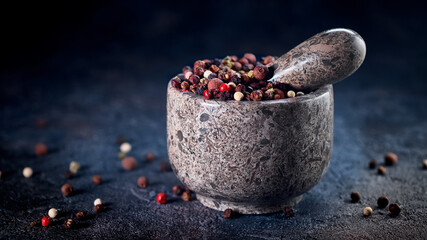Stone Mortar and pestle with pepper seeds