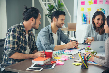 Creative design office center working teamwork. Happy business people partner plan strategy organization research people together at diversity office using laptop, smartphone company conference room