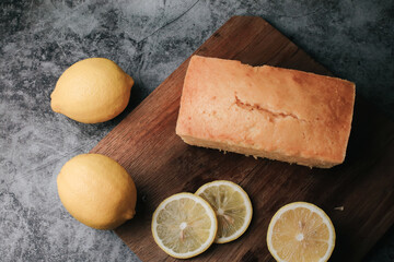 Lemon pound cake with slices of lemon sugar icing. Delicious breakfast, traditional tea time treat. Reciepe of English lemon pie loaf.