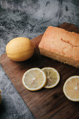 Lemon pound cake with slices of lemon sugar icing. Delicious breakfast, traditional tea time treat. Reciepe of English lemon pie loaf.