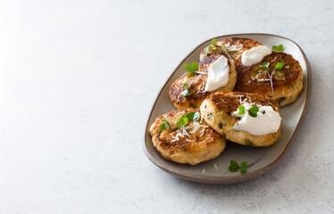 Cottage cheese fritters with parmesan cheese and spinach close up