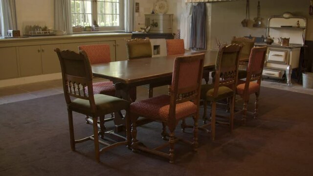 Old dining table and chairs in castle kitchen