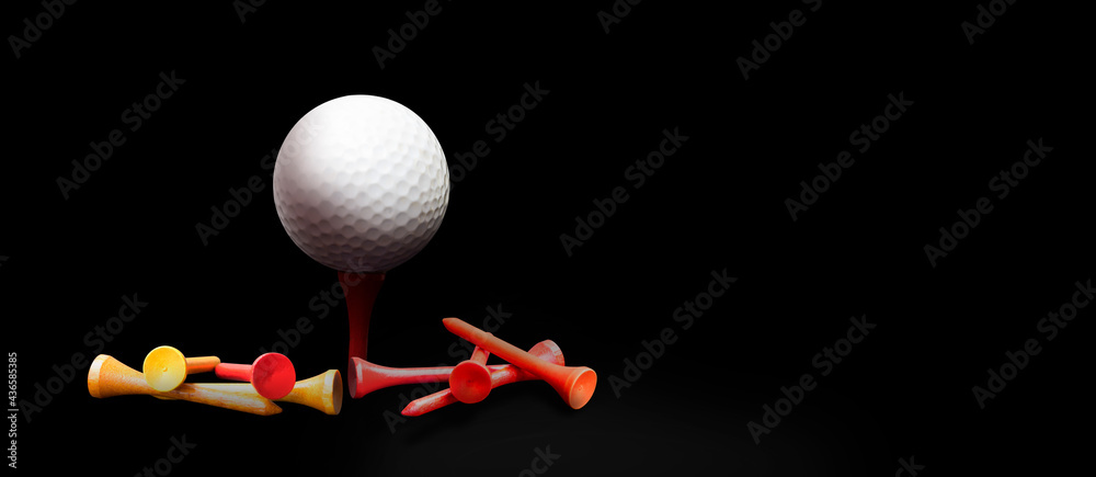 Wall mural banner white golf ball and red, yellow tee on black background