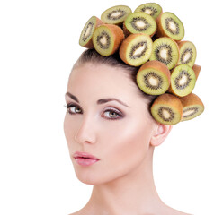 Beautiful woman with hairstyle made ​​from fresh kiwi - 436588529