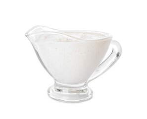 Gravy boat with cashew sour cream on white background