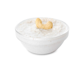 Bowl with cashew sour cream on white background