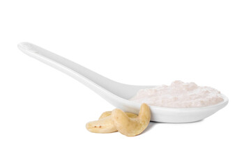 Spoon with cashew sour cream on white background