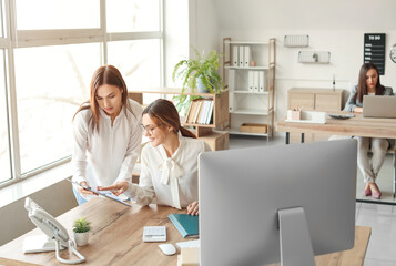 Female accountants working in office