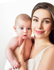 Mother and baby playing and smiling. Happy family.