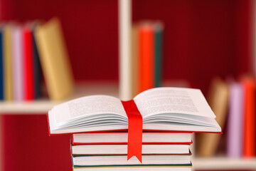 Books with bookmark on color background, closeup