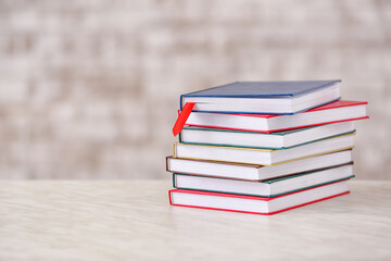 Books with bookmark on light background
