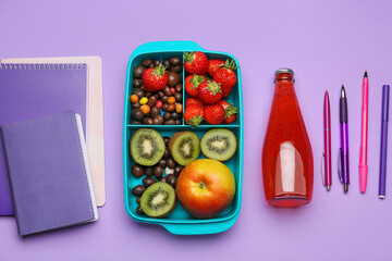 Lunchbox with tasty food and stationery on color background