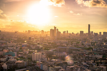 The high angle background of the city view with the secret light of the evening, blurring of night lights, showing the distribution of condominiums, dense homes in the capital community