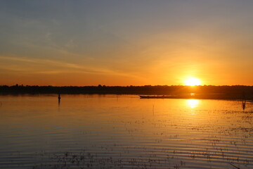 Cambodia. Sunrise. West Lake 15 km from Siem Reap. Dug in the 10th century to supply water to the temples of Angkor during the dry season. Siem Reap province.