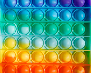 Colorful rainbow anti-stress fidget push pop it sensory toys for children. Simple dimple. 