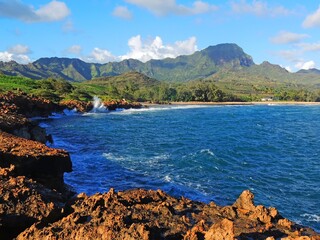Spectacularly-eroded coastline and surf at  shipwreck  beach along the mahaulepu heritage trail in poipu, kauai, Hawaii