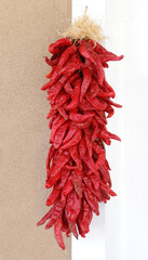    a decorative red chile pepper pod ristra hanging in santa fe plaza in santa fe, new mexico   