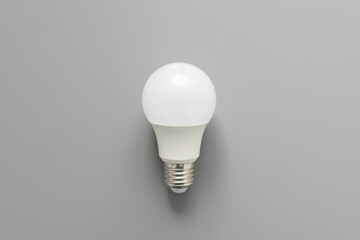 Light bulb on gray background close up