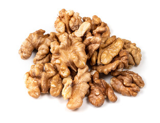 pile of shelled walnuts closeup on white