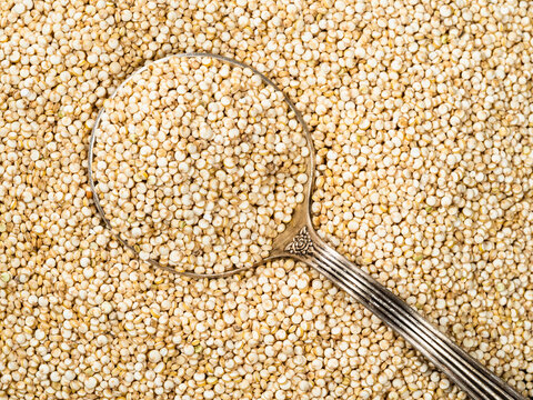 top view of tablespoon in quinoa seeds