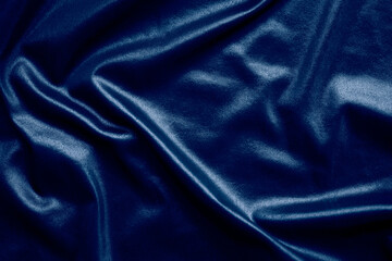 Dark blue silk texture abstract background. new modern design luxurious light and soft wave smooth shape fabric wallpaper. flat lay with free space. for card poster or presentation products concept.