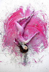 Young naked woman in pink, gray white, color, painted, lies decorative, elegantly dancing on the...