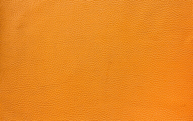 close up of orange or brown leather sheet texture background 