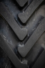 Close-up of a wheel of a tractor Belarus. Strong tread ridge on the wheel. Rural life