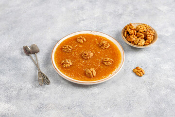 Traditional Azerbaijan,Indian,Turkish sweet dessert halva with walnuts on top.