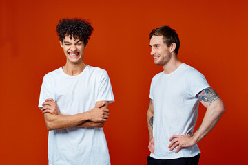 Two cheerful friends t-shirts communicating isolated background friendship