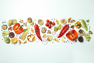 Tasty grilled vegetables on white background, top view