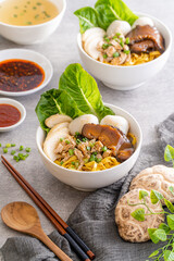 Bak chor mee. The noodles are tossed in vinegar, minced meat, pork slices, pork liver, stewed sliced mushrooms, meat balls and bits of deep-fried lard