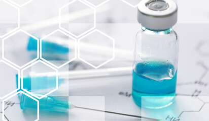 small jars with injection and syringe for injection on a blue background near the chemical formula