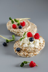 Diet crispy breads with cream cheese, vegetables and fruits. Fitness food. Diet. Healthy food
