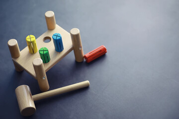 Children's development. Children's wooden toy on the table in the play area. Room of children's creativity and self-development. Wooden constructor.