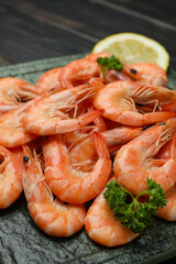 Plate with tasty cooked shrimps, close up