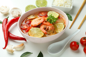 Tom yum soup and ingredients on white background