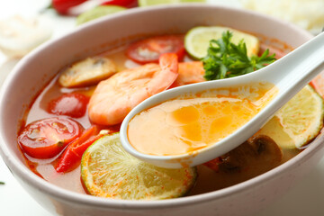 Plate of tasty Tom yum soup, close up