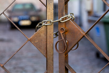 Old metal lock on chain