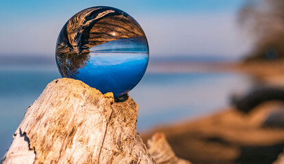 Crystal ball alpine landscape shot at the famous Chiemsee, Chieming, Chiemgau, Bavaria, Germany