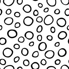 Spotty abstract vector seamless pattern. Random rings, dots, circles, spots, stains, bubbles, stones. Design for fabric, funny cute print. Irregular random texture. Repetitive graphic background