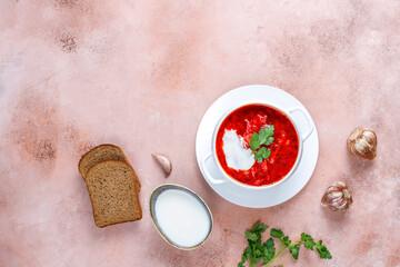 Traditional Ukrainian Russian borscht or red beetroot soup in the bowl.