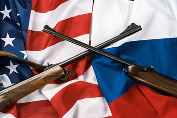 Usa flag and Russia flag background with two crossed shotguns