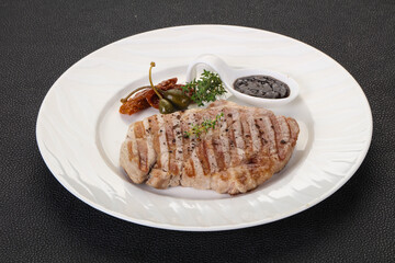 Grilled pork steak with pepper sauce