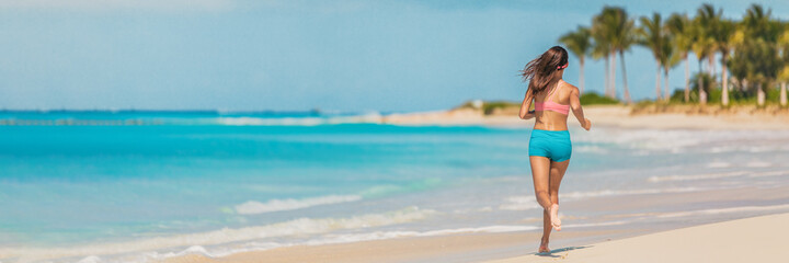 Athlete runner fitness woman running on Caribbean beach landscape banner panoramic background....