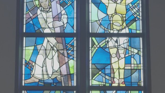 Colorful stained glass window, Stations of the Cross and Crucifixion of Jesus Christ